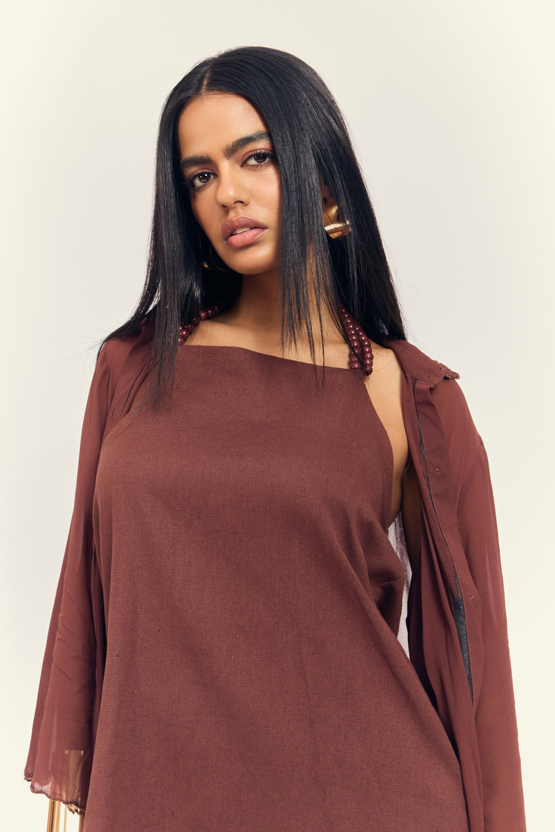 Stardust Dress Set in Ground Coffee — close-up of halter dress with beaded straps and sheer shirt