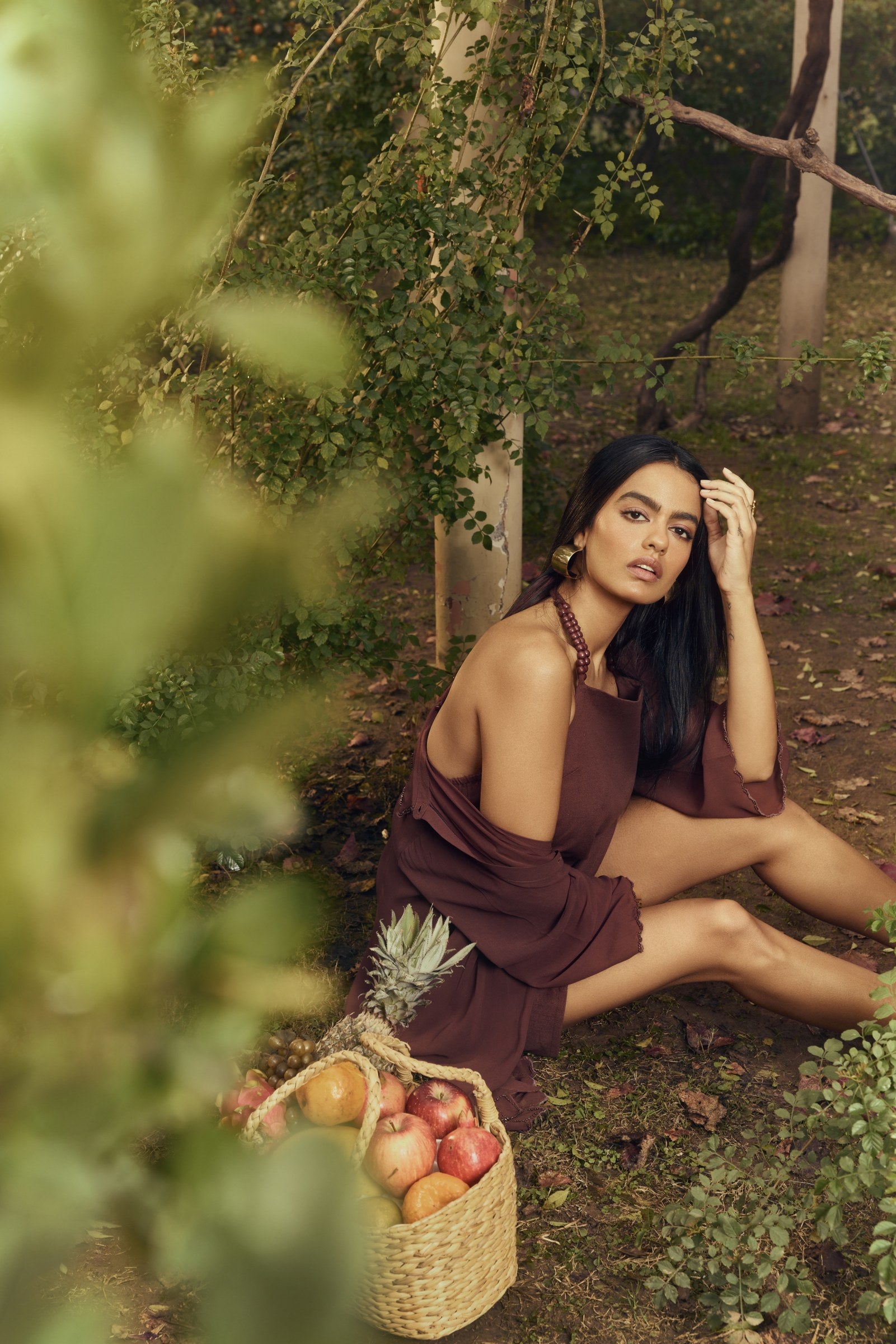Stardust Dress Set in Ground Coffee — seated editorial look with sheer shirt draped